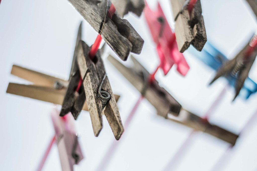 close-up of clothes pins on line